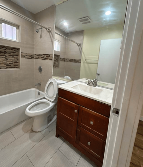 a bathroom with a sink toilet and a shower