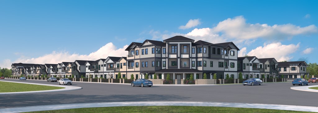 A row of houses with cars parked in front.