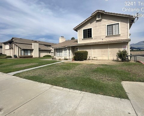 A house with a driveway in front of it.
