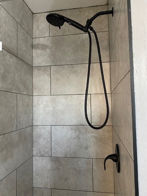 a shower in a bathroom with a shower head