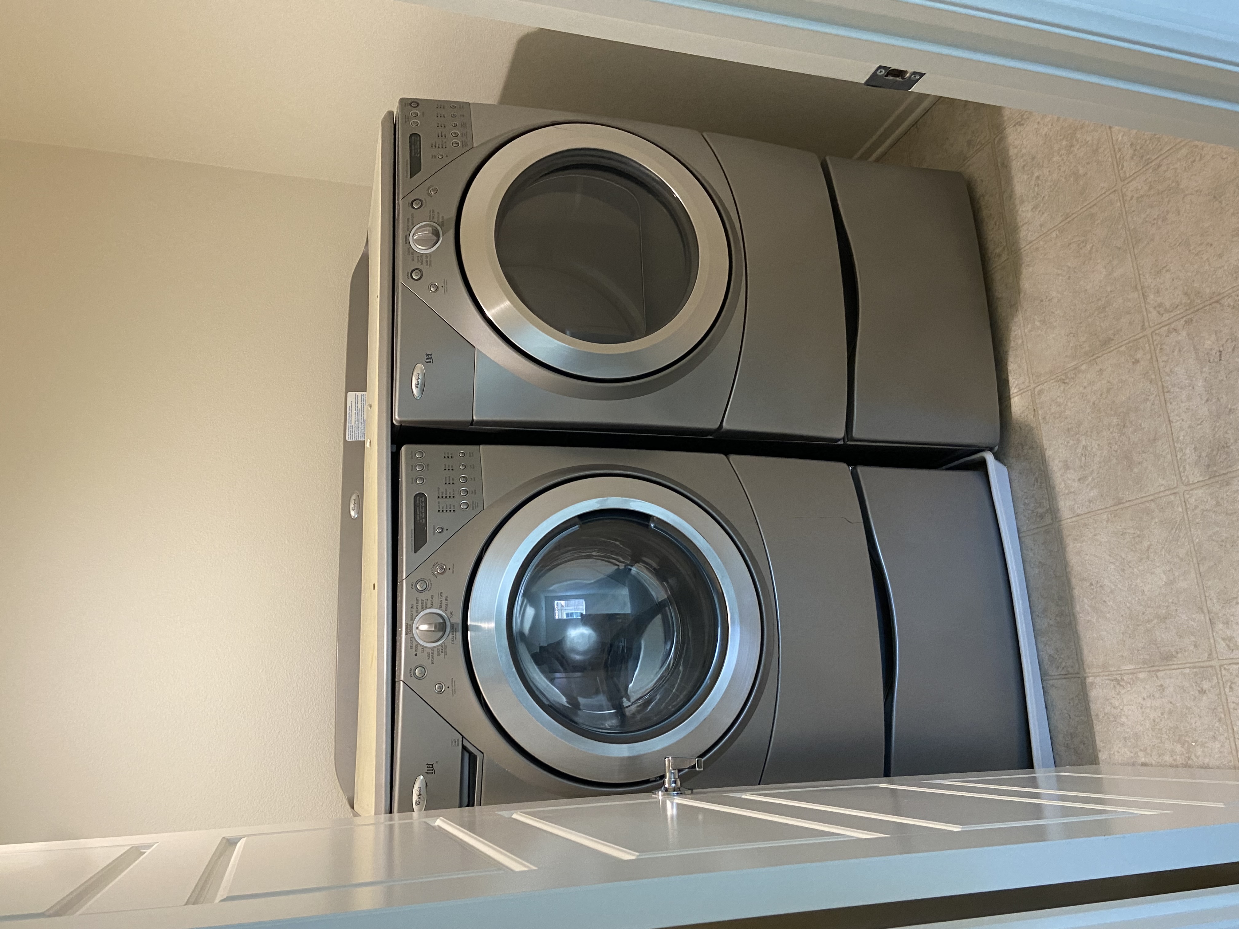 a washing machine and dryer stacked on top of each other