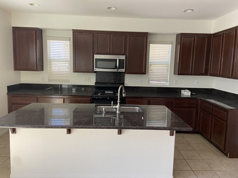 a kitchen with a counter top and a sink