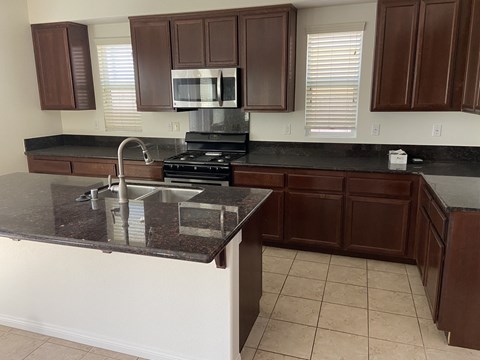 a kitchen with a counter top and a sink