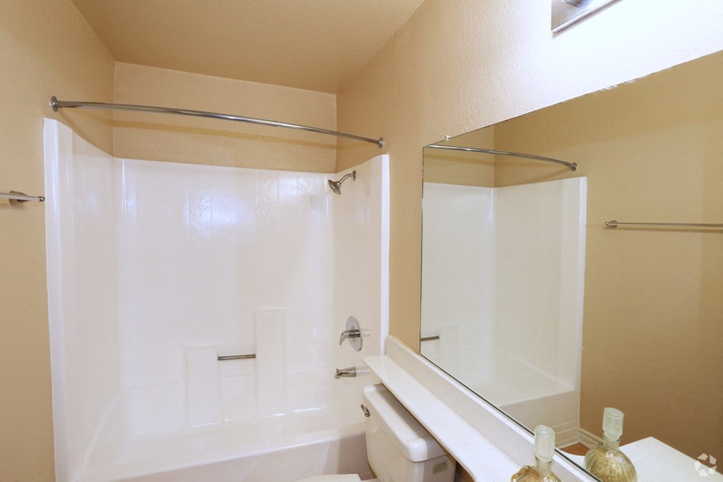 a bathroom with a bathtub and a sink