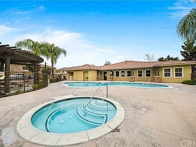a pool with a hot tub in the middle of a building