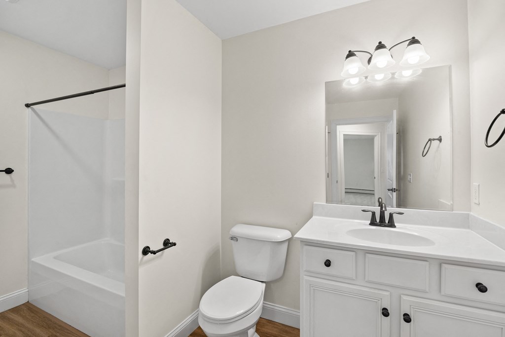 a bathroom with a sink toilet and a shower