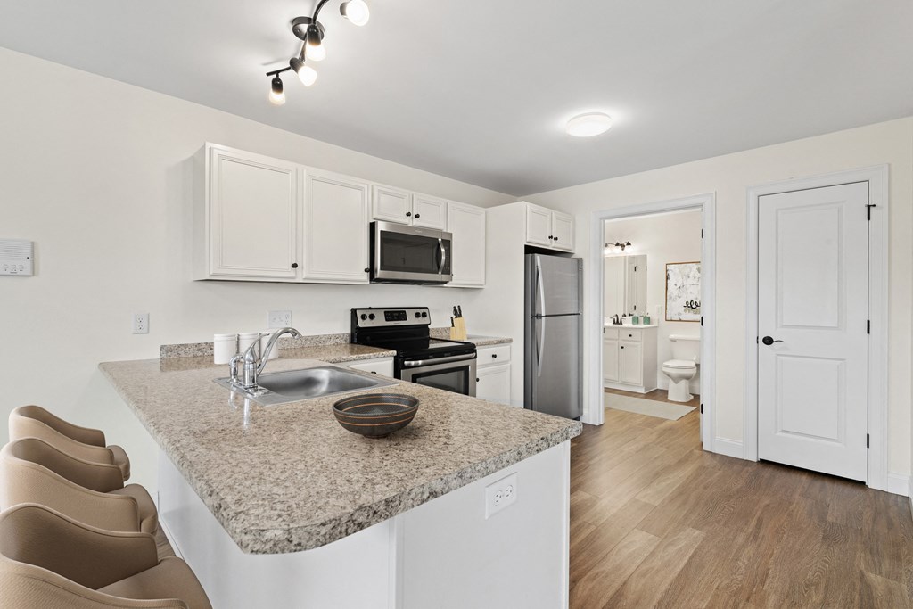 a kitchen with a granite counter top and a sink