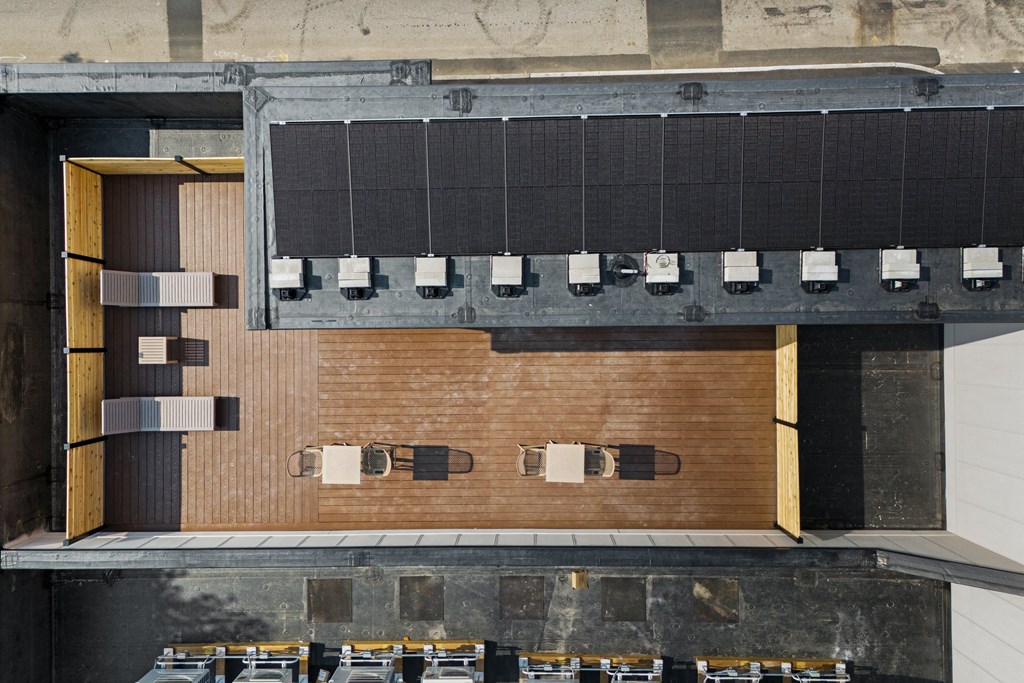 an overhead view of the auditorium of a building with brick walls and a wood