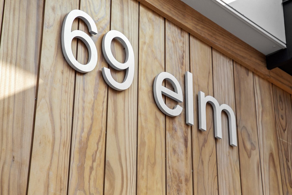 a sign on the side of a building with the go affirm logo on it