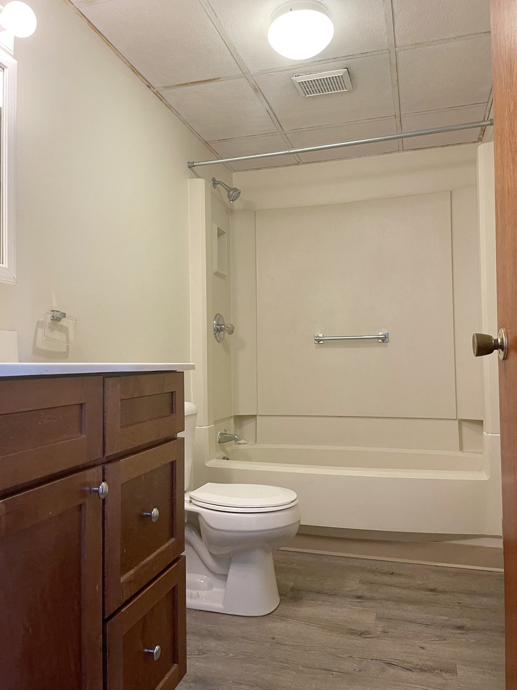 a bathroom with a toilet and a bath tub