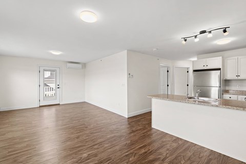 A kitchen area with a counter and cabinets.