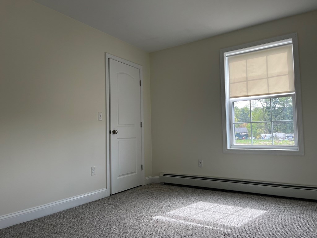 A room with a window and a door.