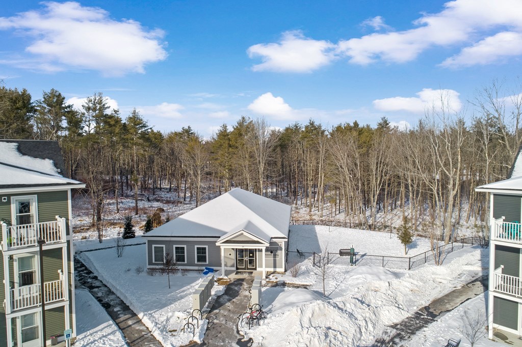 an aerial view of a house in the snow