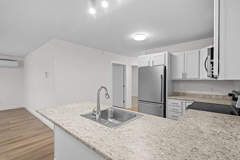 a kitchen with granite counter tops and a sink