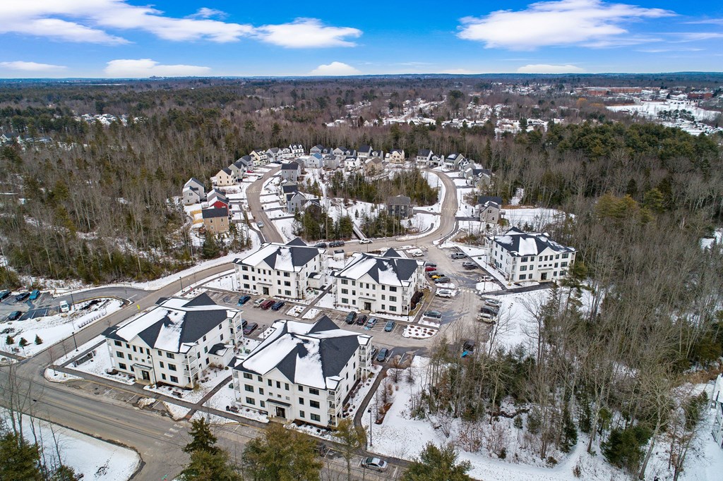 arial view of a large group of buildings in the snow