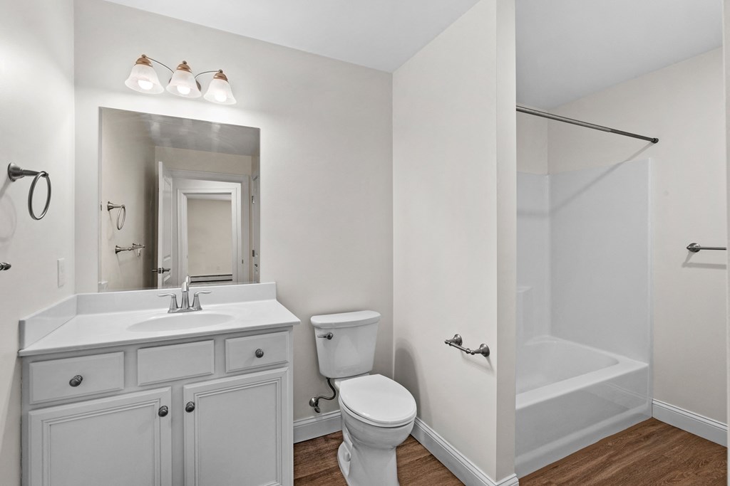 a bathroom with a sink toilet and a shower