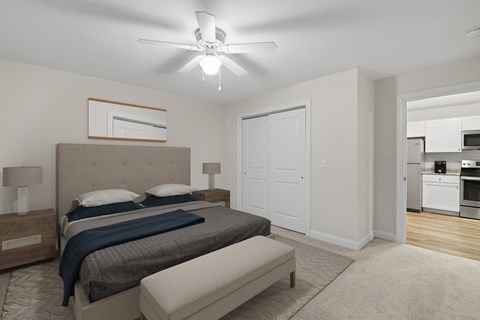 a bedroom with a bed and a ceiling fan