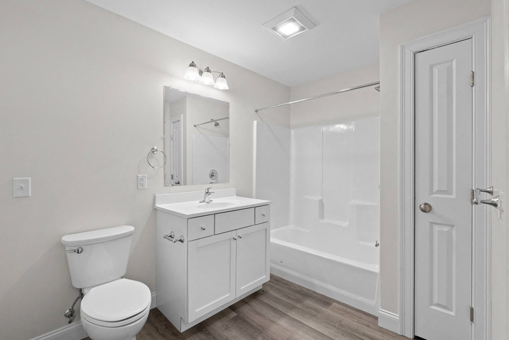 a bathroom with a sink toilet and a shower