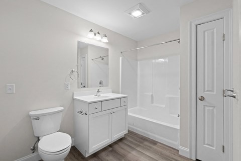 a bathroom with a sink toilet and a shower