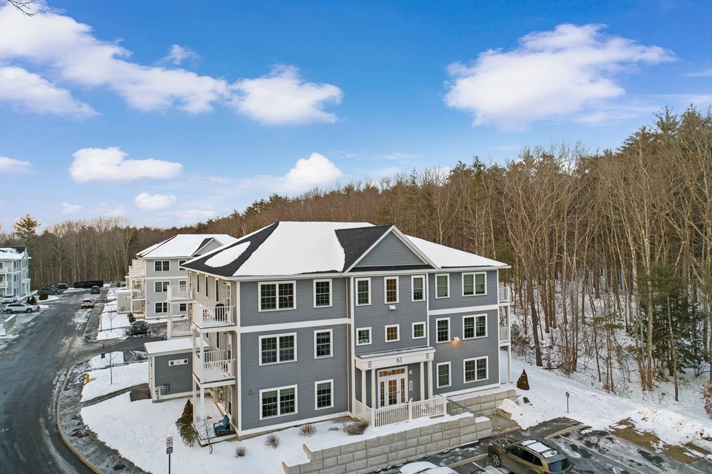 aerial view of a large house in the snow