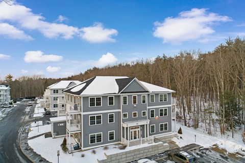 aerial view of a large house in the snow