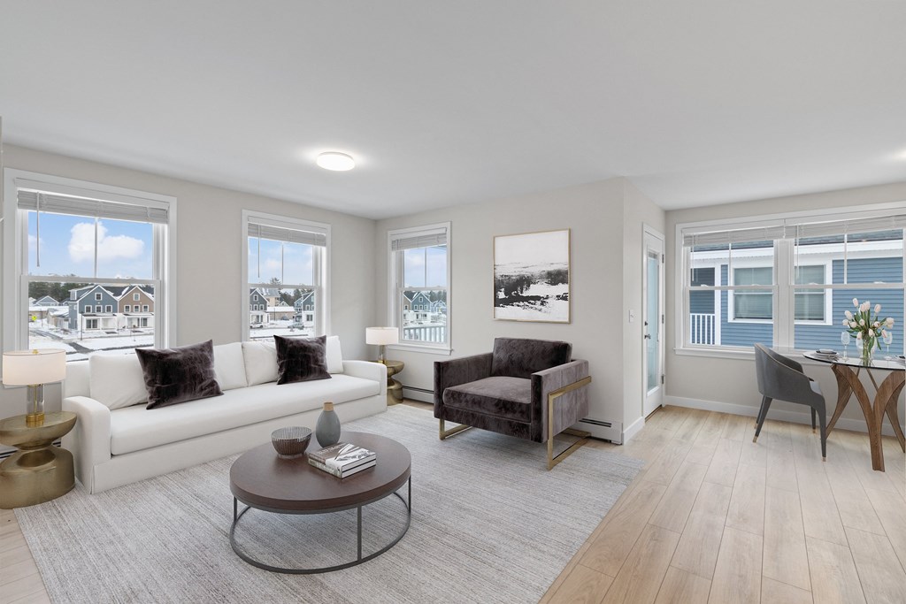 a living room with a white couch and a table