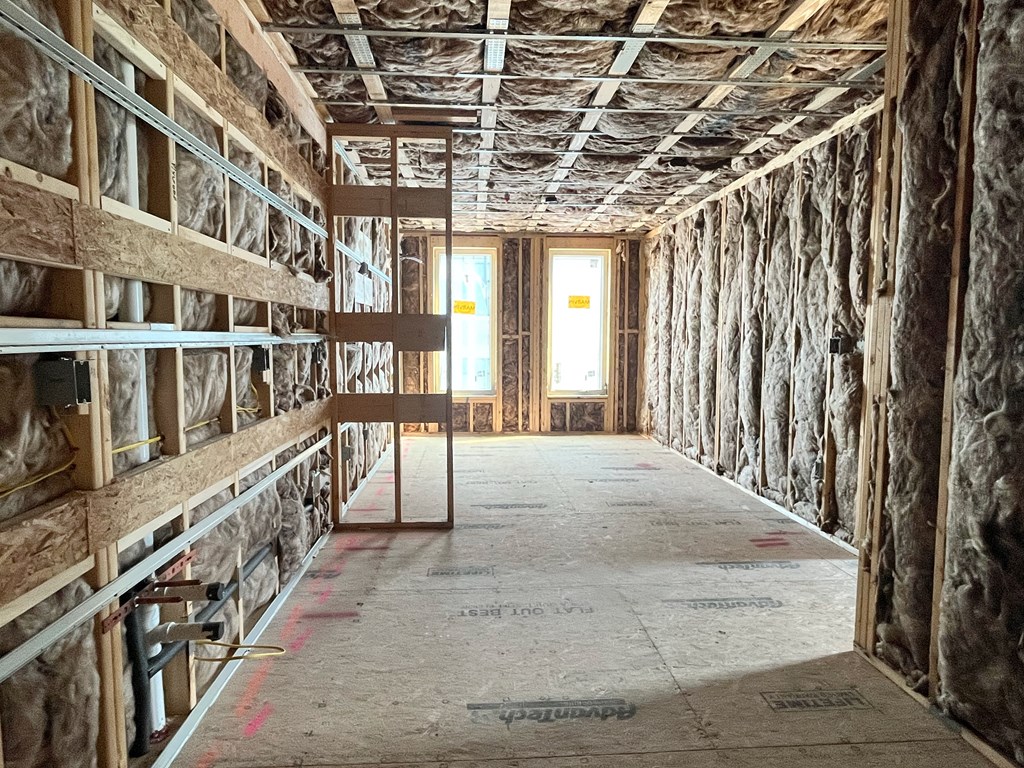 a room filled with unfinished walls and shelves in a building