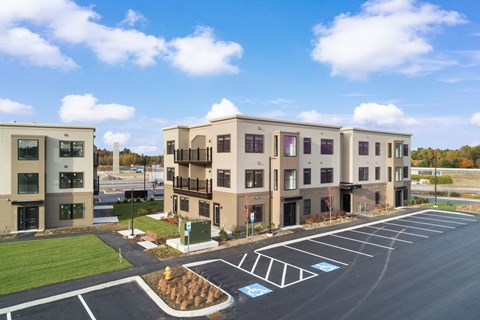 Blue skies, manicured grounds, and modern living—The Parker welcomes you home.