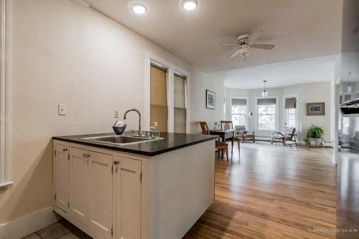 a kitchen with a sink and a counter top