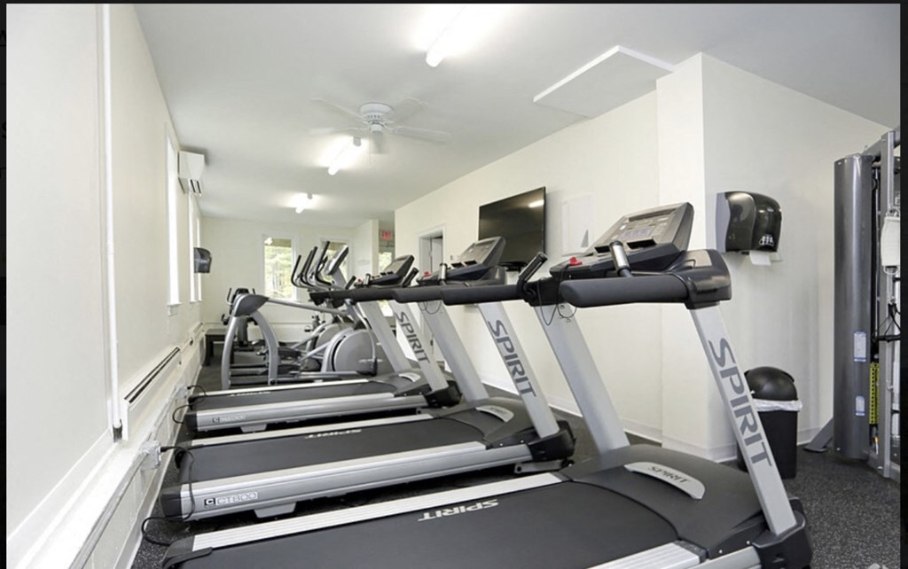 the gym is equipped with state of the art cardio equipment including treadmills and