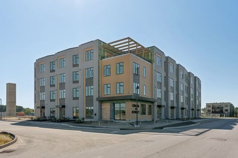 A large building with a lot of windows is under construction.