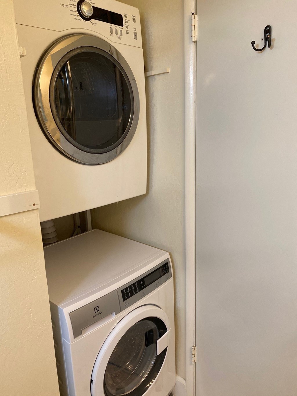 a washing machine and a dryer in a laundry room