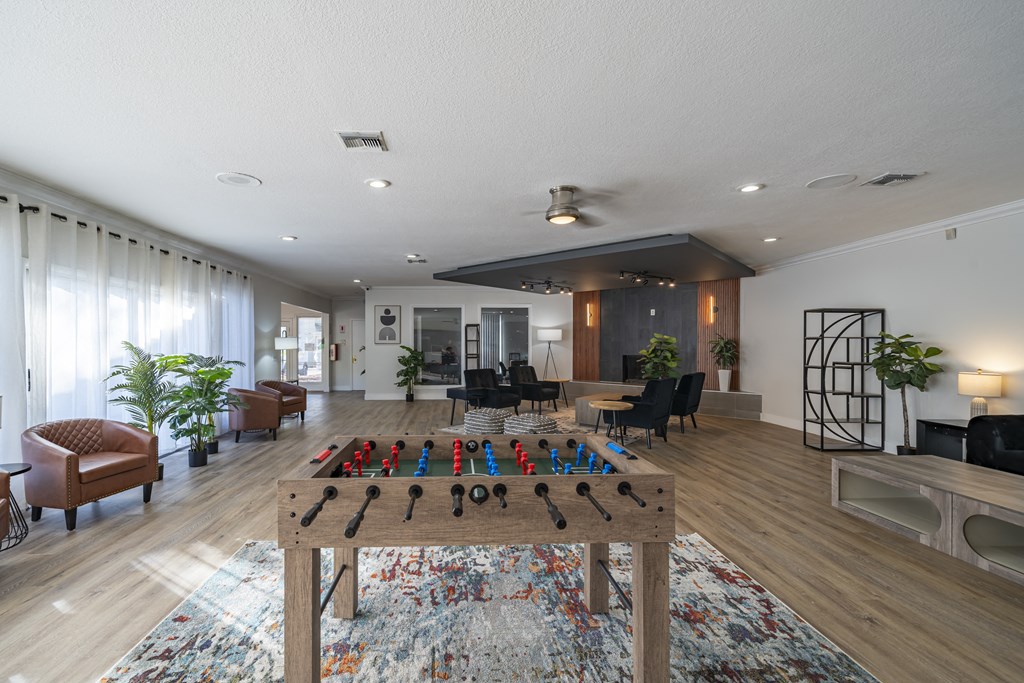 A room with a table and chairs and a rug on the floor. at Red Bay Apartment Complex, Jacksonville, FL, 32211