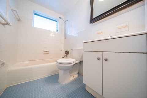 a bathroom with a toilet sink and bathtub