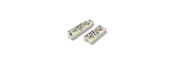 Two white rectangular objects with cutouts in them.