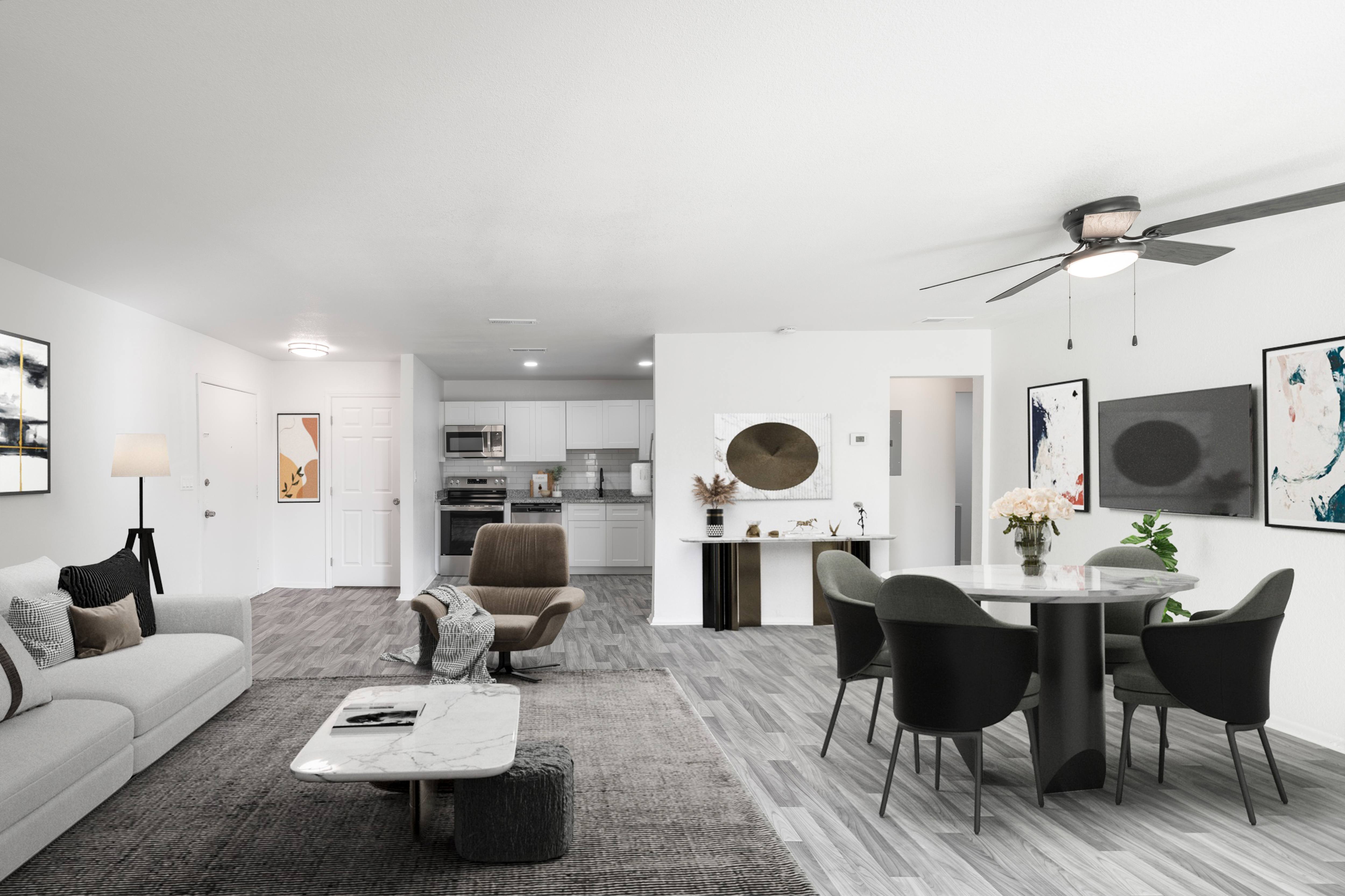A modern living room with a grey carpet and a white sofa.