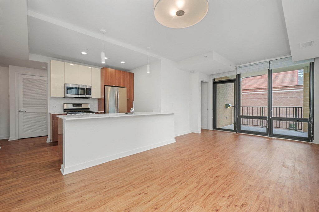 Modern kitchen with entertainment space apartments downtown Chicago 60654 at Hensley Chicago, Illinois