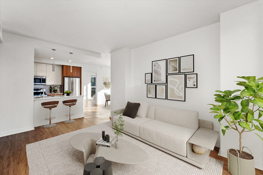 A living room with a white couch and a coffee table at Chateau on Wells, Chicago