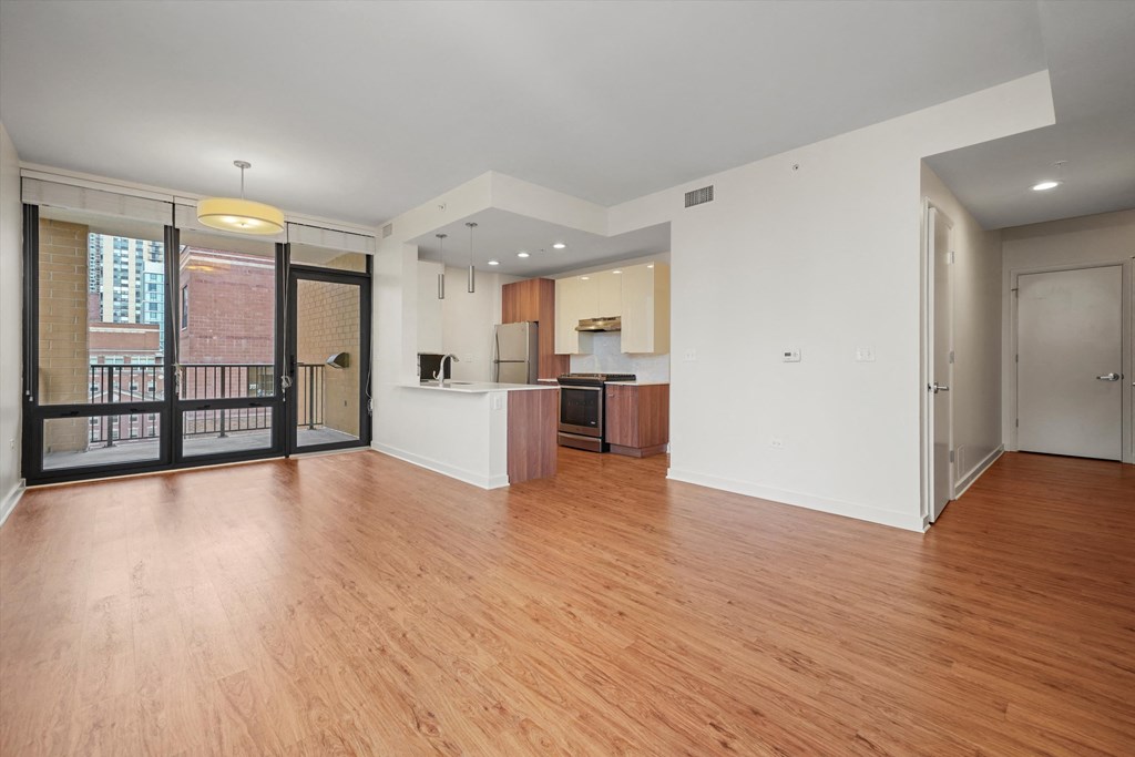 Modern kitchen with hardwood floors with tons of space apartments downtown Chicago 60654 at Hensley Chicago, Illinois