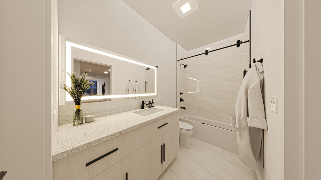 a bathroom with a sink and a mirror and a shower at Chateau on Wells, Illinois