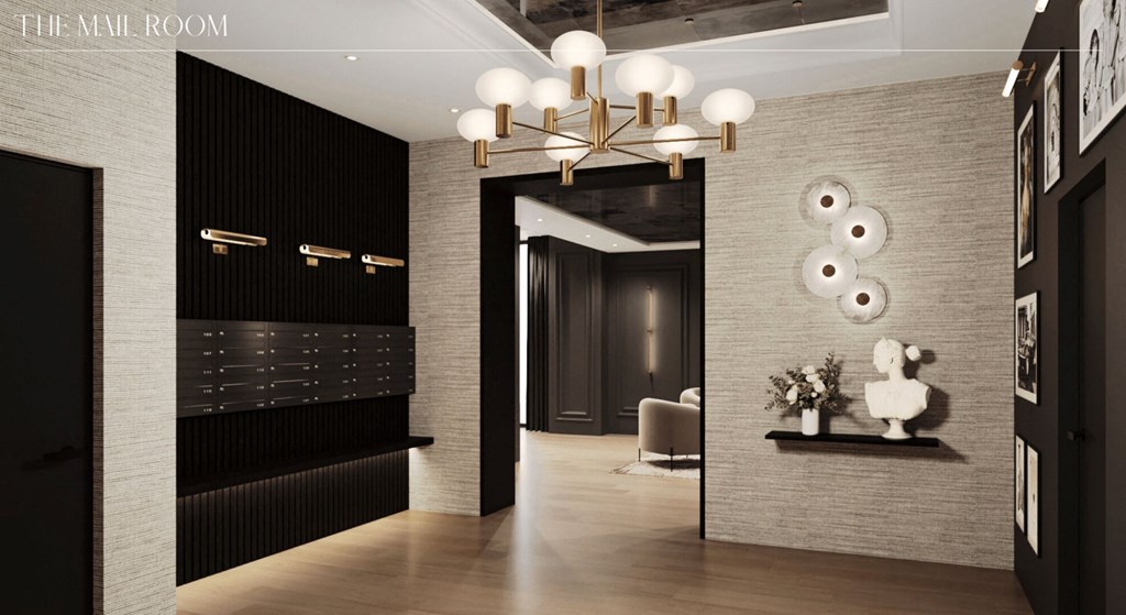 a hallway with a large mirror and a chandelier at Chateau on Wells, Chicago, Illinois