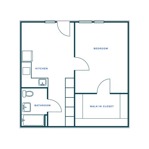 A floor plan of a small apartment with a kitchen, bathroom, bedroom, and walk-in closet.