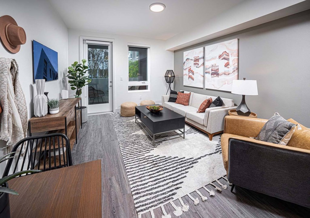 a living room with gray walls and a sliding glass door