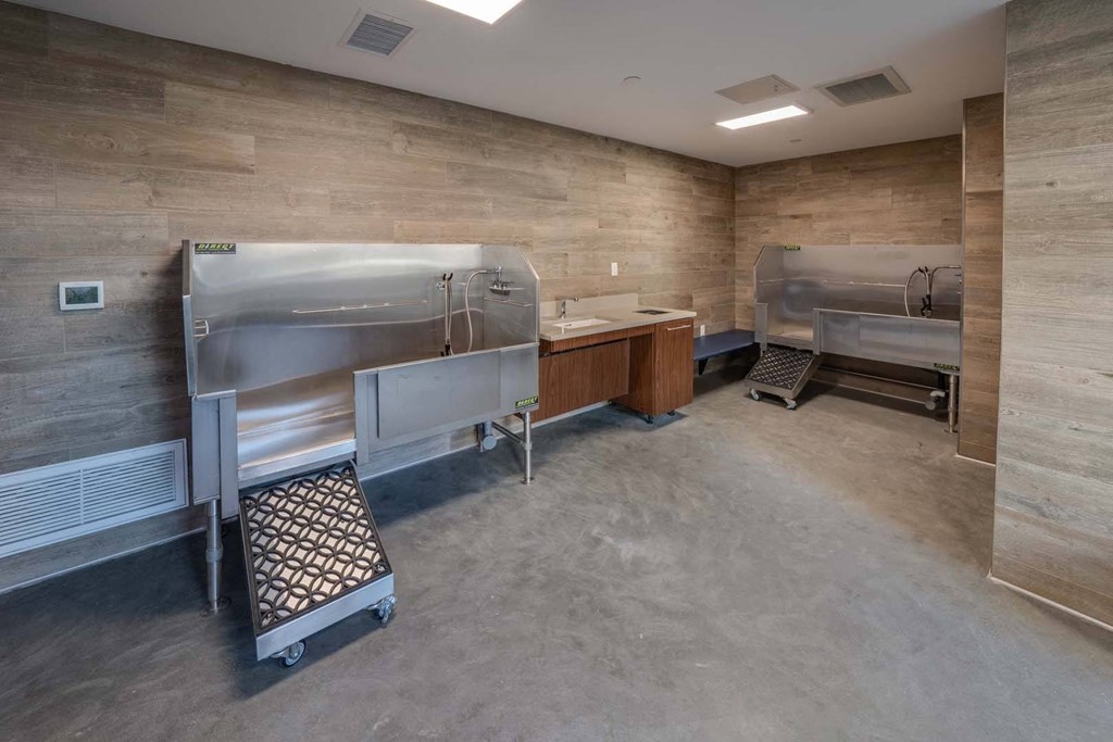 a large room with two refrigerators and a sink