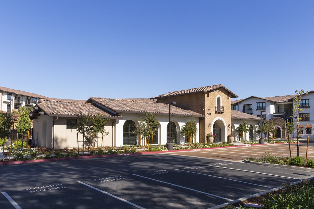 a large building with a parking lot in front of it