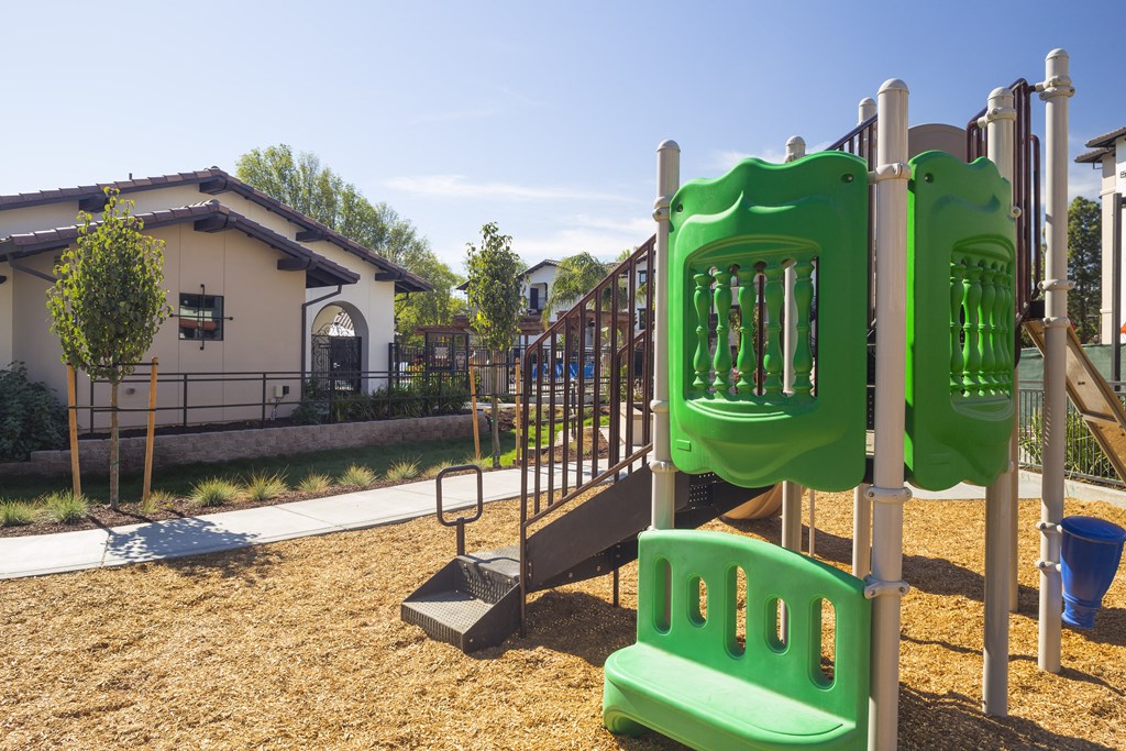 a playground at the whispering winds apartments in pearland, tx