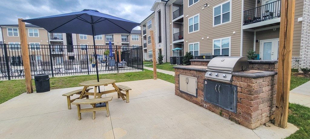 our apartments have a patio with a grill and an umbrella at Sage Springs, Kentucky, 42710