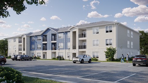 A row of modern apartment buildings with cars parked in front.