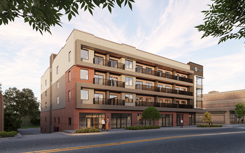 A modern apartment building with balconies and multiple stories.