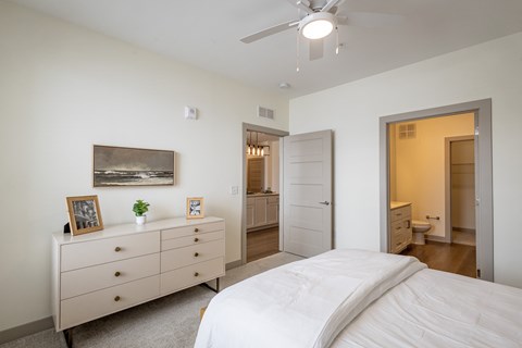 Bright bedroom with ensuite bathroom and walk-in closet at Allure Apartments, Indiana
